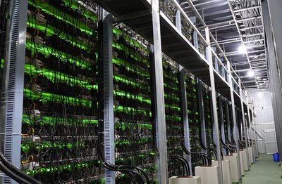 A vast mining farm illuminated with rows of high-performance mining rigs operating continuously
